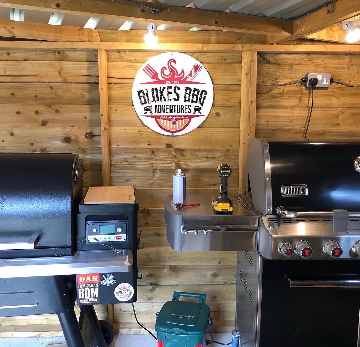 The Blokes BBQ Adventures cooking station with grills and branded sign