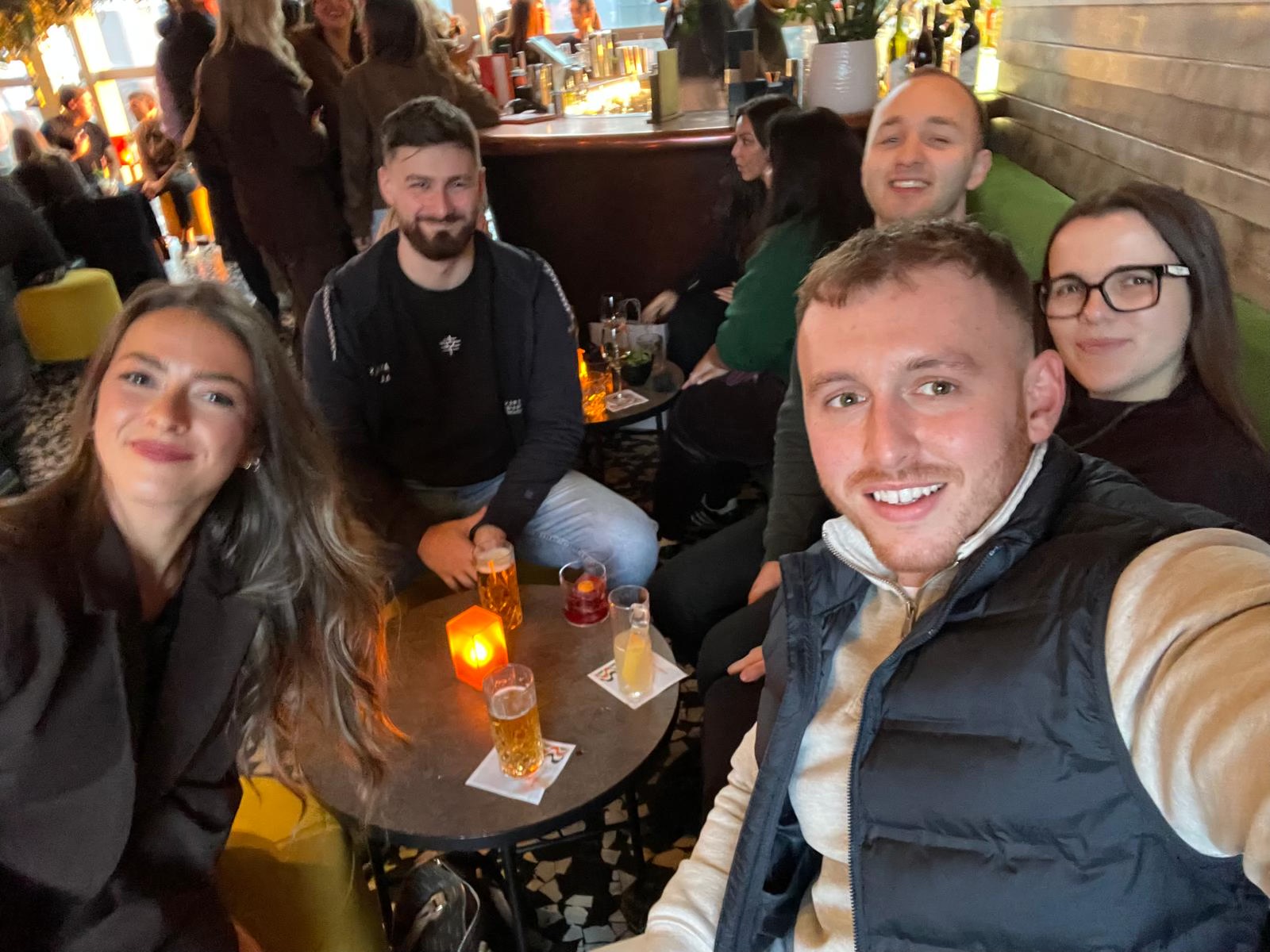 Claire and George enjoying drinks with friends