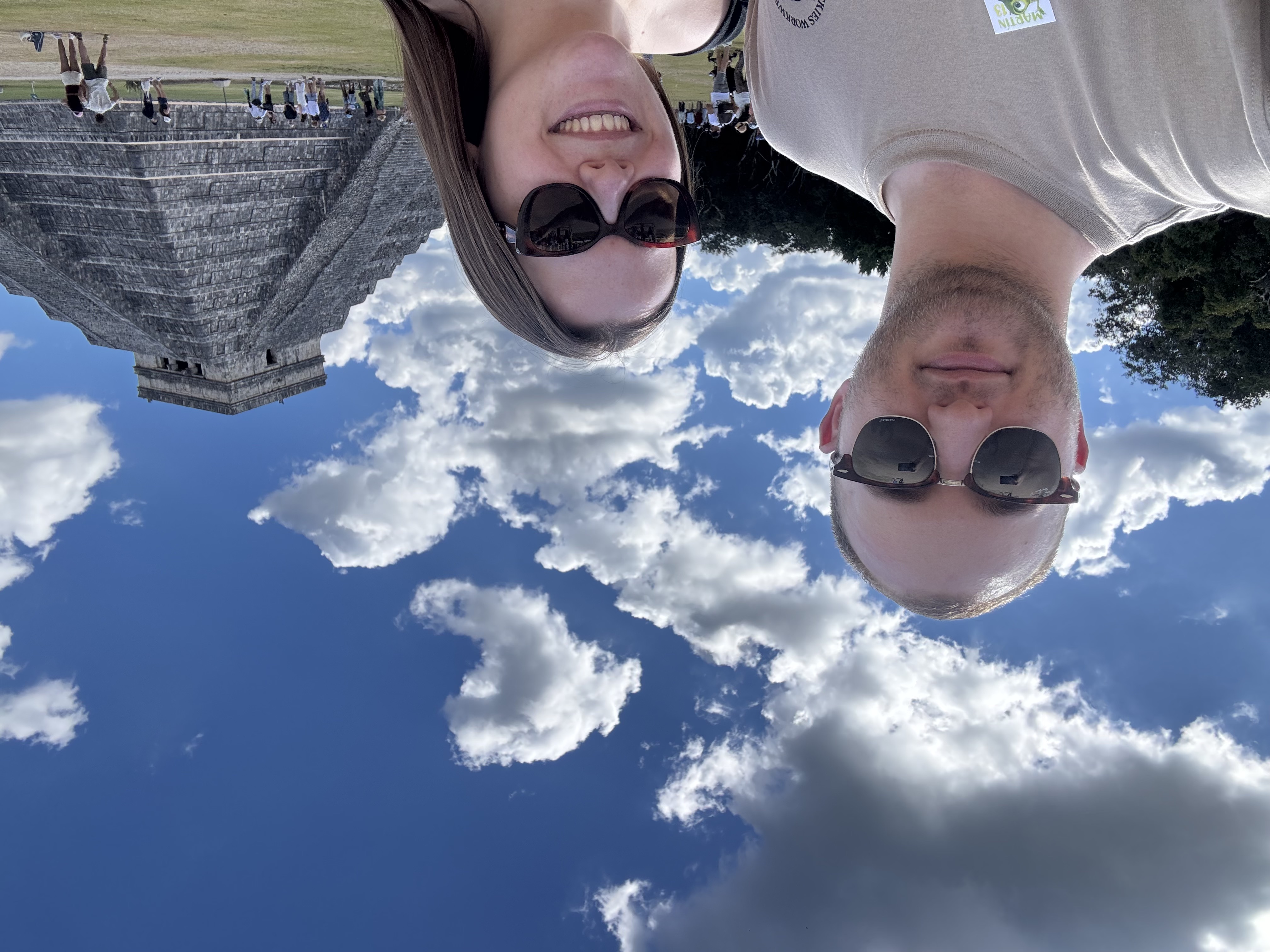 Claire and George together beneath a bright blue sky