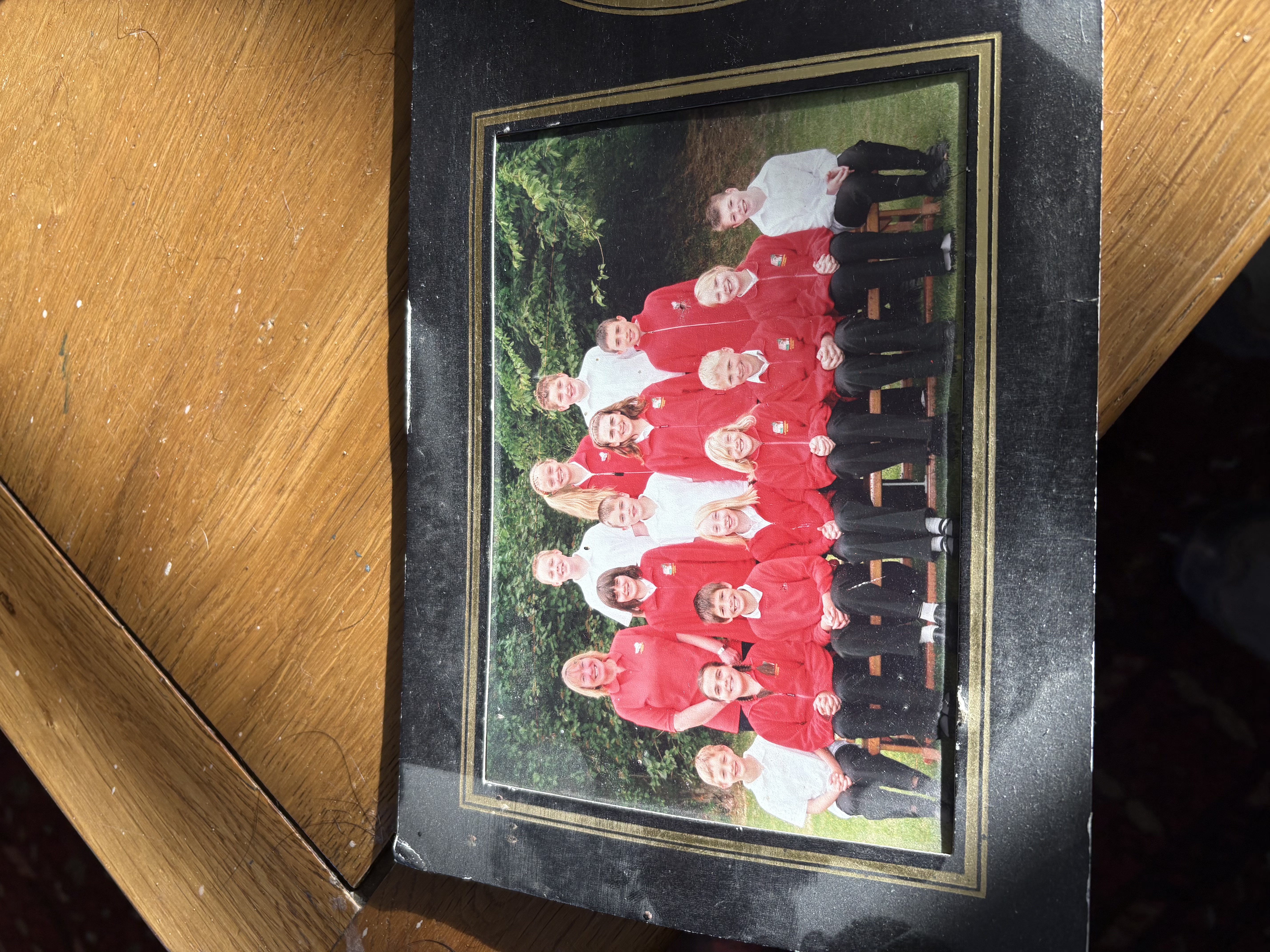Claire and George's primary school class in red and white uniforms